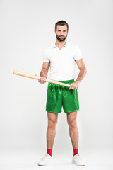 Fototapeta premium handsome sportsman holding baseball bat, isolated on grey