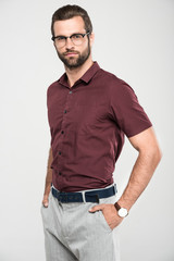 Fototapeta premium handsome bearded man posing in casual closing and eyeglasses, isolated on grey