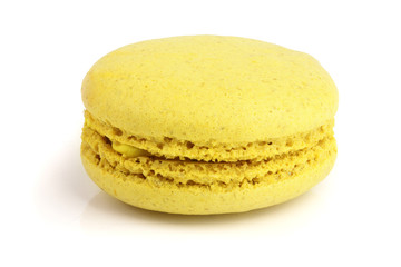 yellow macaron isolated on white background closeup