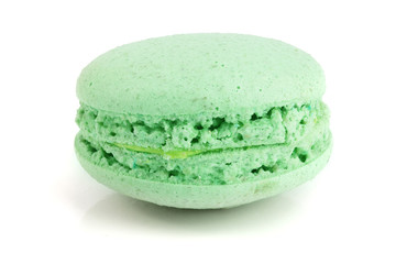 green macaron isolated on white background closeup