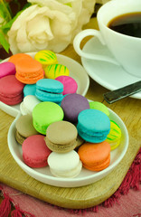 Colorful macarons on white plate Close up image and selective focus
