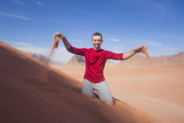 Fototapeta na wymiar Tourist in Wadi Rum Desert, Jordan