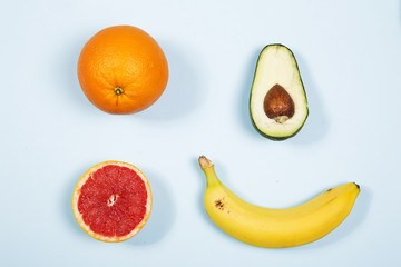 The group fresh fruits against blue background