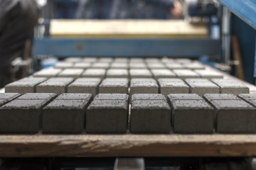 Production of concrete paving stones