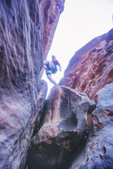 Tourist on the rocks, canyon of Khazali. Wadi Rum Desert, Jordan