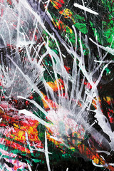 Abstract painting shows white splashes blown by compressed air over colorful background. White areas for text