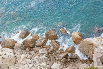 View from Above on the Sea and Stones or Rocks in the City of Taormina. The island of Sicily, Italy. Beautiful and Scenic View of the Sea and Rocks