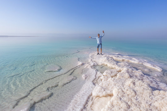 Tourist on the shore of the Dead Sea. Jordan landscape