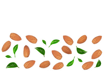almonds decorated with leaves isolated on white background with copy space for your text. Top view. Flat lay pattern