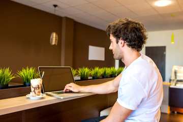 Handsome man in a coffee shop