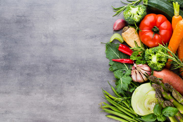 Flat lay of various colorful raw vegetables.