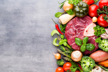 Raw fresh meat Ribeye Steak with vegetables and spice.