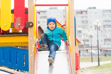 boy plays on the hill