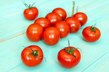 Cherry tomatoes on wooden background