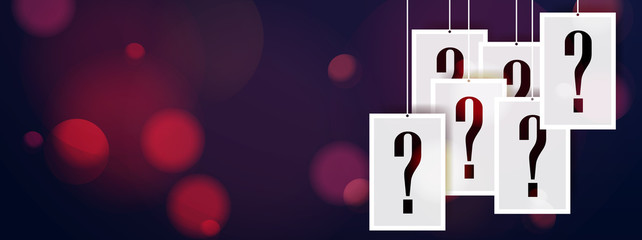 Hanging question stickers header with blurred bokeh lights in the background. Question mark hanging concept.
