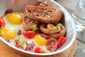 Scrambled eggs on the wooden table