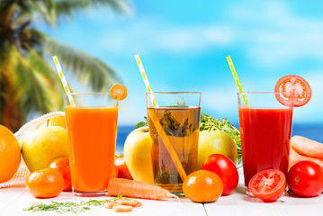 Fresh juice, Orange, apple, carrot and tomato drinks on white background. 
