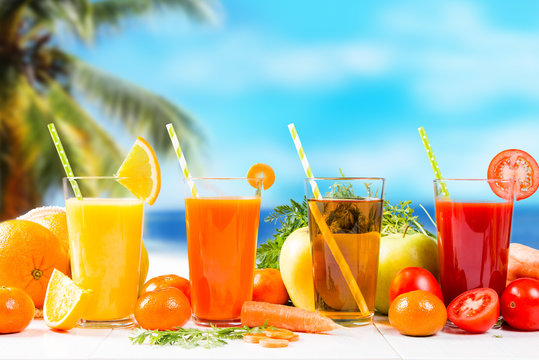 Fresh juice, Orange, apple, carrot and tomato drinks on white background. 