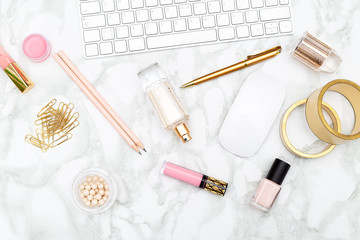White keyboard and female accessories on a marble background. Flat lay