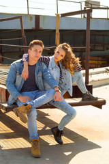 Obraz na płótnie Canvas Young beautiful attractive fashion couple wearing jeans clothes in daylight. Love concept.