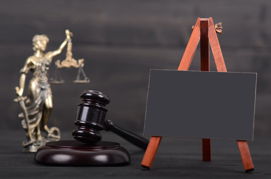 Blackboard, Judge Gavel, Lady Justice on the wooden background