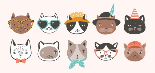 Collection of cute funny cat faces or heads wearing glasses, sunglasses and hats. Bundle of various cartoon animal muzzles isolated on light background. Colorful hand drawn vector illustration. © Good Studio