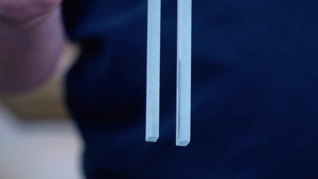 The trembling of the tuning fork after hitting it
