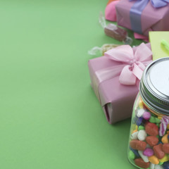 Festive composition set of gift boxes with balls candy cocktail materials.