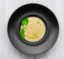 mushroom cream soup on white wooden board
