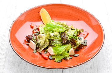 Salad with tomatoes, olives, mozzarella and basil