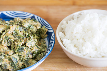Delicious Chinese meal, Chinese food, Scrambled Eggs with Toona sinensis. Rice and chopsticks