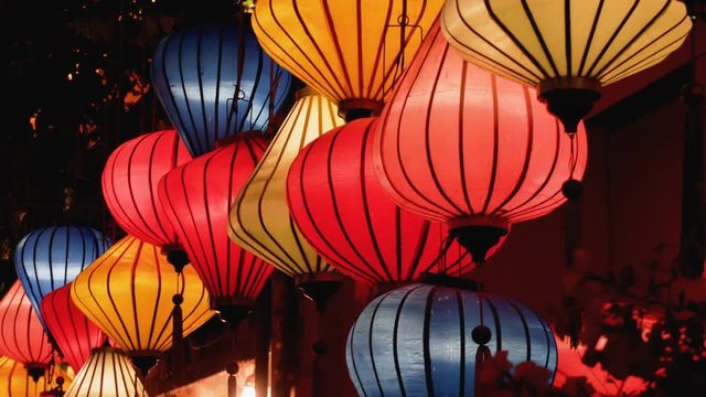 Night view of colorful lanterns swaying in wind at Hoian