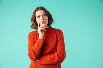 Portrait of a pensive young woman dressed in sweater