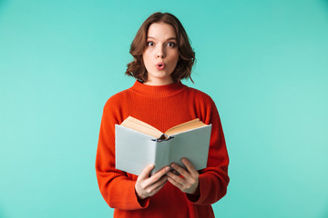 Portrait of a surprised young woman dressed in sweater