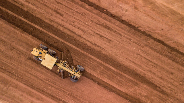 Aerial top view tractor at work.