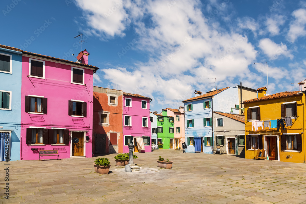 Wall mural Bright colorful houses on Burano island on the edge of the Venetian lagoon. Venice, Italy