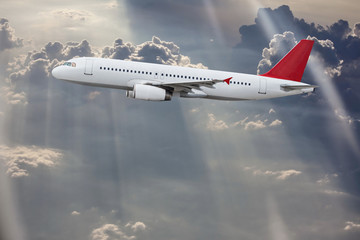 Fototapeta premium Commercial airplane flying above clouds.
