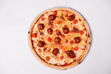 Pizza with meatballs and tomato isolated on white. Top view