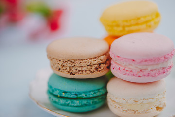 Fototapeta na wymiar Delicious french dessert. Colorful pastel cake macaron or macaroon