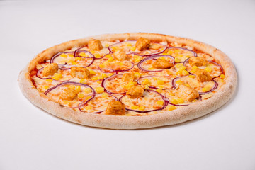 Pizza with chicken, onion and corn isolated on white