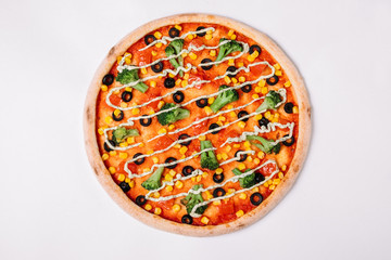 Pizza with vegetables isolated on white. Vegetarian pizza. Top view
