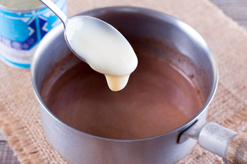 Condensed milk in a spoon