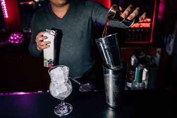 bartender prepares a cocktail
