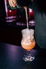 bartender prepares a cocktail