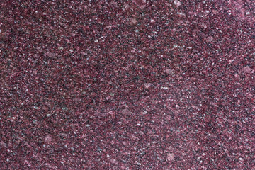 Dark surface of old granite wall