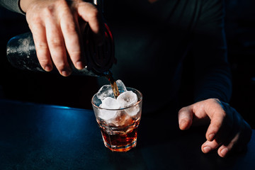 bartender prepares a cocktail