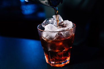 bartender prepares a cocktail