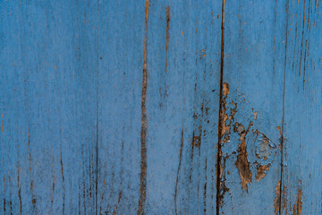 Wooden fence planks background painted in blue