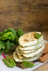 Baker making traditional dish of Armenians from Artsakh Zhingyalov hats is a type of flatbread stuffed with herbs.