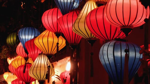 Night view of colorful lanterns swaying in wind at Hoian